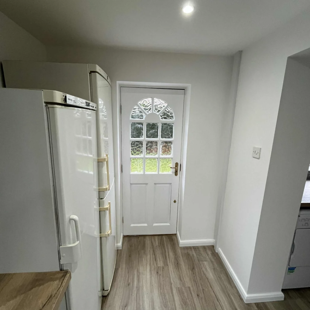 Hallway and utility area with new laminate flooring